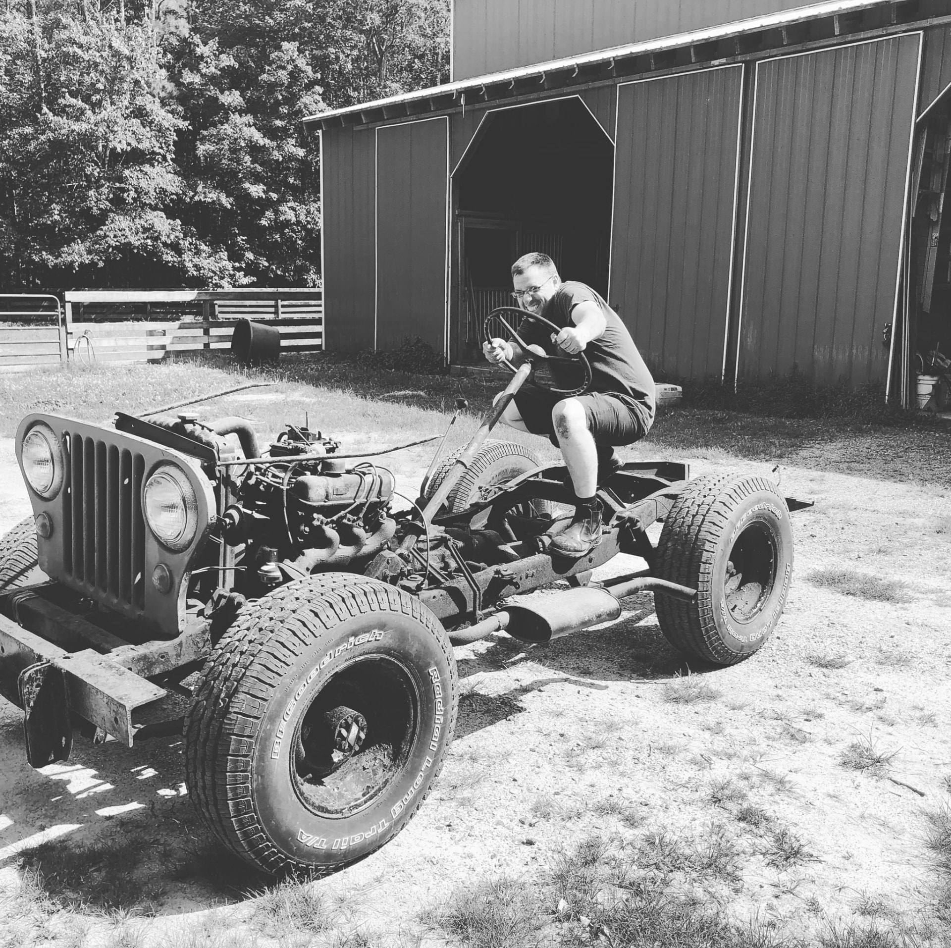 Eli driving a stripped Jeep chassis