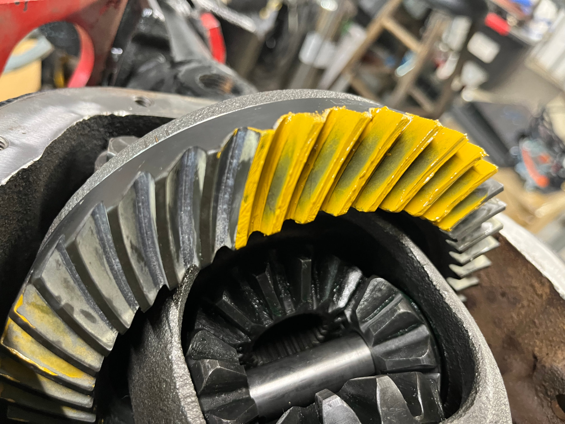 Yellow gear-contact pattern on a ring gear during EFJ axle setup.